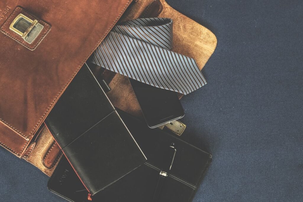 Leather bag and accessories flat lay